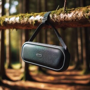 Flat, rectangular waterproof bluetooth speakers (like a Bose SoundLink Flex) hanging from a tree branch using its loop, forest clearing backdrop, dappled sunlight, focus on the speaker's texture and form, outdoor photography.